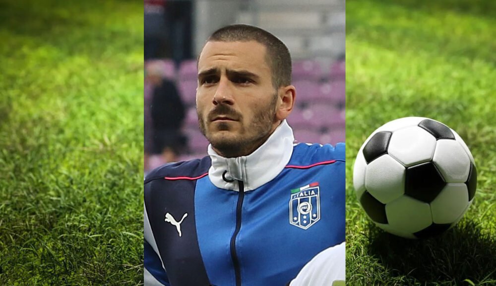 Calciatore della Nazionale Italiana di calcio con divisa azzurra e pallone sul prato verde