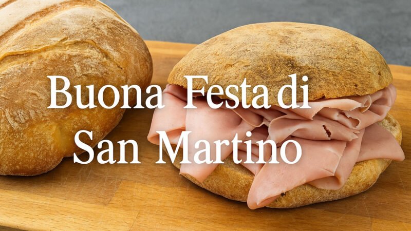 Pane caldo e mufulette con mortadella su banco da lavoro di fornaio durante la Festa di San Martino a Trapani